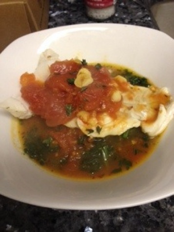 Poached Cod in Tomato Saffron Broth over Spinach